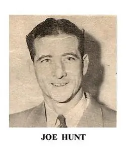 A black and white photo of a man in suit