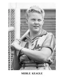 A young boy holding a baseball bat in his hands.