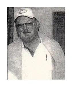 A man wearing glasses and a white hat.