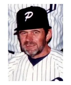 A baseball player wearing a black and white uniform.