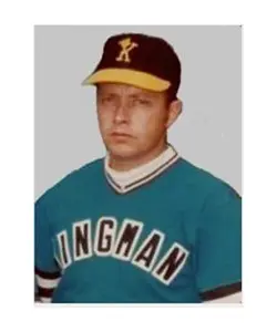 A baseball player in his uniform is wearing a hat.