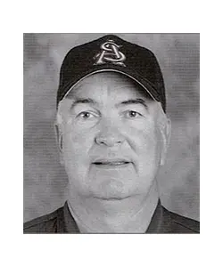 A black and white photo of an older man wearing a baseball cap.