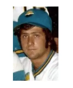 A baseball player in his uniform and hat.