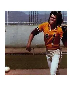 A man in an orange and white baseball uniform.