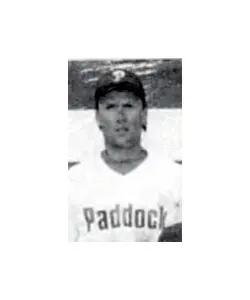 A black and white photo of a baseball player.