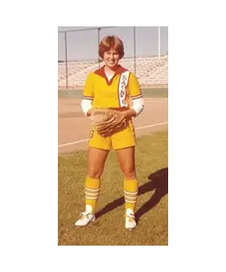 A young boy in yellow baseball uniform holding a catchers mitt.