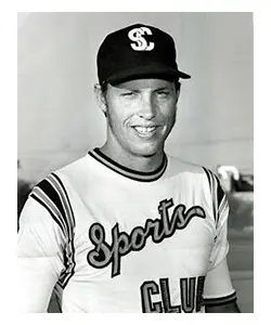 A black and white photo of a baseball player.