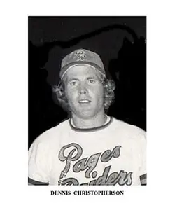 A black and white photo of a baseball player.