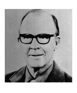 A black and white photo of an older man wearing glasses.