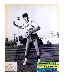 A baseball player is standing on the field.