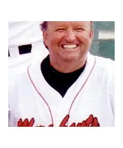 A close up of a baseball player smiling