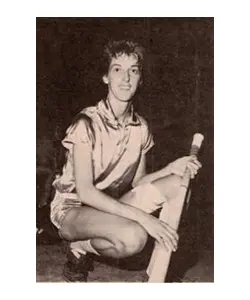 A young man holding a baseball bat in his hand.