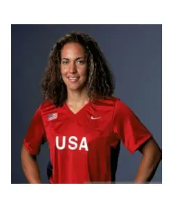 A woman in red shirt posing for the camera.