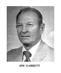 A black and white photo of an older man.