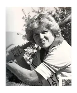 A black and white photo of a man holding a baseball bat.