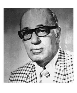 A man in glasses and a plaid jacket.