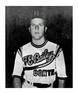 A baseball player in his uniform is posing for the camera.