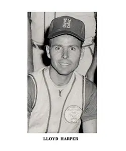 A black and white photo of a baseball player.