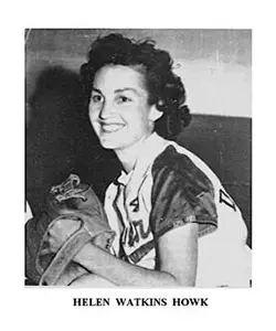 A black and white photo of a woman holding a cat.