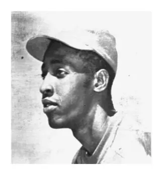 A black and white photo of a baseball player.