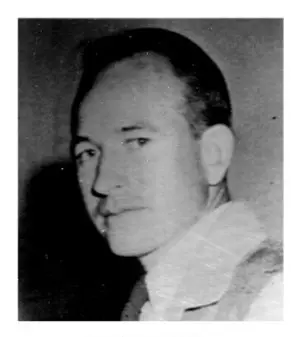 A black and white photo of a man in military garb.