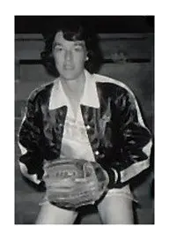 A man in a baseball uniform holding a glove.