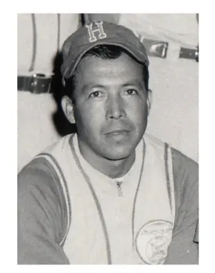 A man in a baseball uniform and hat.