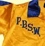 A yellow and blue football jersey with the letters p. B. S. W.