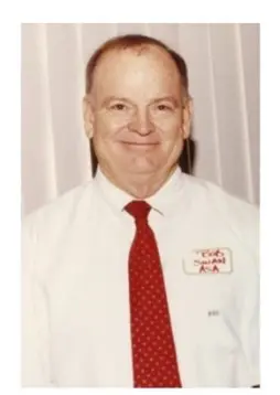 A man in a red tie and white shirt.